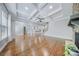 Large living room showcasing hardwood floors, a coffered ceiling, and an open floor plan at 8169 Clems Branch Rd, Indian Land, SC 29707
