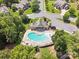 Aerial shot showcases a community pool area with a clubhouse, lounge chairs, and manicured landscaping at 8169 Clems Branch Rd, Indian Land, SC 29707