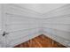 Walk-in closet with a hardwood floor and multiple levels of wire shelving at 8169 Clems Branch Rd, Indian Land, SC 29707