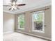 Bedroom with two windows and ceiling fan at 9009 Tayside Ct, Huntersville, NC 28078