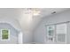 Bright bonus room offering natural light, a ceiling fan, and cozy carpet at 9009 Tayside Ct, Huntersville, NC 28078