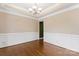 Formal dining room featuring hardwood floors and decorative wainscoting at 9009 Tayside Ct, Huntersville, NC 28078