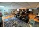 Finished basement offers a theater seating area with a wet bar and stainless steel refrigerator at 901 Ridge St, Albemarle, NC 28001