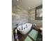 Luxurious bathroom with modern tub, gray tile walls, dark floor, and accent painting at 901 Ridge St, Albemarle, NC 28001