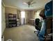 Bedroom with neutral carpet, ceiling fan, two windows, and furniture at 901 Ridge St, Albemarle, NC 28001