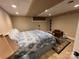 Cozy bedroom with recessed lighting, tan walls, a patterned comforter, and a dark rug at 901 Ridge St, Albemarle, NC 28001