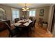 Cozy dining room with a chandelier, windows, and ample seating for Gathering gatherings at 901 Ridge St, Albemarle, NC 28001