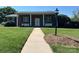 Inviting brick home featuring a well-kept lawn and walkway leading to the front door at 901 Ridge St, Albemarle, NC 28001