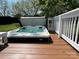 A luxurious outdoor hot tub on a wooden deck, perfect for relaxation and enjoying the peaceful backyard at 901 Ridge St, Albemarle, NC 28001