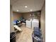 Laundry room with modern washer and dryer, folding table and tile floors at 901 Ridge St, Albemarle, NC 28001