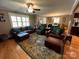 Cozy living room featuring hardwood floors and plenty of comfortable seating at 901 Ridge St, Albemarle, NC 28001