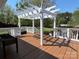 Wooden deck with a pergola overlooking a large grassy backyard at 901 Ridge St, Albemarle, NC 28001