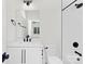 Well-lit bathroom featuring white vanity, white subway tile in shower, and modern fixtures at 9020 Tynecastle Commons Ct, Charlotte, NC 28226