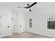 Bright bedroom with hardwood floor, white trim, multiple doors and natural light, providing a serene atmosphere at 9020 Tynecastle Commons Ct, Charlotte, NC 28226