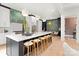 Gourmet kitchen with a spacious island, bar stool seating, and designer pendant lighting at 9020 Tynecastle Commons Ct, Charlotte, NC 28226