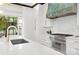 Bright kitchen with stainless appliances, quartz counters, large windows and eat-in bar seating at 9020 Tynecastle Commons Ct, Charlotte, NC 28226