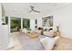 Bright living room with large windows, modern decor, and a neutral color palette at 9020 Tynecastle Commons Ct, Charlotte, NC 28226