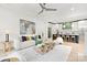 Inviting living room with stylish furnishings, a modern fireplace, and an open view to the kitchen at 9020 Tynecastle Commons Ct, Charlotte, NC 28226