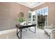 Bright home office with a modern desk, accent rug, and large windows at 9020 Tynecastle Commons Ct, Charlotte, NC 28226