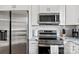 Modern kitchen featuring stainless steel appliances, white cabinets, and subway tile backsplash at 912 W A St, Kannapolis, NC 28081