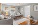 Cozy living room with hardwood floors, neutral decor, and plenty of natural light at 912 W A St, Kannapolis, NC 28081