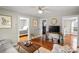 Cozy living room with hardwood floors, neutral paint colors and vintage furnishings at 912 W A St, Kannapolis, NC 28081