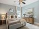 Relaxing bedroom featuring neutral colors, a ceiling fan, and stylish decor at 100 Verbena Ct, Weddington, NC 28173