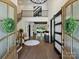 Grand foyer with a view to an open living area, featuring hardwood floors and stylish decor at 100 Verbena Ct, Weddington, NC 28173