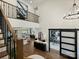 Open-concept foyer with a view of a home office, dining, and living area from the upper level at 100 Verbena Ct, Weddington, NC 28173