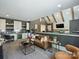 Cozy living room adjacent to a full bar and pool table, perfect for entertaining at 100 Verbena Ct, Weddington, NC 28173