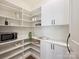Walk-in pantry with ample shelving and storage space at 100 Verbena Ct, Weddington, NC 28173
