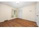 Simple bedroom with hardwood flooring, closet, and natural light at 1012 Hawkinstown Rd, Salisbury, NC 28144