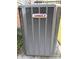 Close up of Lennox AC unit with brick siding and green vegetation at 107 Plumtree Dr, Kings Mountain, NC 28086