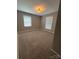 Spacious carpeted bedroom featuring neutral paint, natural light, and modern ceiling fan at 107 Plumtree Dr, Kings Mountain, NC 28086