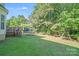 Spacious backyard featuring a well-maintained lawn, trampoline, and play area at 10803 Gold Pan Rd, Charlotte, NC 28215