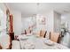 Elegant dining room with chandelier, table set with white linens and decor, plus hardwood floors at 10803 Gold Pan Rd, Charlotte, NC 28215