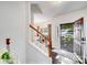 Entryway of home featuring staircase and dining room with lots of natural light at 10803 Gold Pan Rd, Charlotte, NC 28215