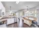 The open kitchen design has a peninsula and an island allowing for great flow into the dining and living spaces at 10803 Gold Pan Rd, Charlotte, NC 28215