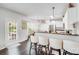 Open kitchen with bar seating and backyard access at 10803 Gold Pan Rd, Charlotte, NC 28215