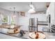 Beautiful kitchen with stainless steel appliances, white cabinets, and dining space at 10803 Gold Pan Rd, Charlotte, NC 28215