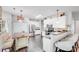 Bright kitchen with stainless steel appliances, a kitchen island and sleek dark hardwood floors at 10803 Gold Pan Rd, Charlotte, NC 28215