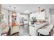 Bright kitchen with stainless steel appliances, a kitchen island and sleek dark hardwood floors at 10803 Gold Pan Rd, Charlotte, NC 28215