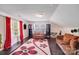 Inviting bonus room with hardwood flooring, plenty of natural light, and room to gather with Gathering at 10803 Gold Pan Rd, Charlotte, NC 28215