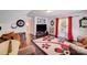 Cozy living room with plush seating, hardwood floors, a decorative rug, and stylish accents at 10803 Gold Pan Rd, Charlotte, NC 28215