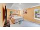 Inviting primary bedroom with tray ceilings, neutral color palette, and abundant natural light at 10803 Gold Pan Rd, Charlotte, NC 28215