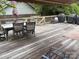 Spacious wooden deck featuring patio furniture, a grill, and an umbrella at 1104 Valley St, Statesville, NC 28677