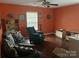 Spacious living room with a sofa, recliner, hardwood floors, and large window at 1104 Valley St, Statesville, NC 28677