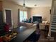 Relaxing living room featuring stylish furniture, ample natural light, and modern home office setup at 1104 Valley St, Statesville, NC 28677