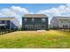 A spacious backyard with a large grass area, perfect for outdoor activities and relaxation at 117 Rooster Tail Ln, Troutman, NC 28166