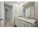 Bathroom with a double sink vanity and large mirror offering functionality and space at 117 Rooster Tail Ln, Troutman, NC 28166